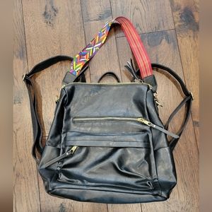 Black backpack with colorful shoulder strap